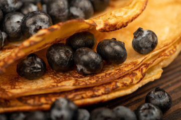 Fresh blueberries and traditional Russian pancakes. Shrovetide week of the end of winter.