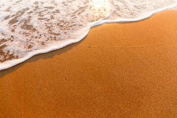 Fototapeta na wymiar Soft sea wave on a sandy beach.