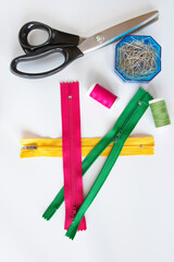 half open pink yellow and green zipper. Selective Focus. isolated White Background. Top View