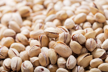 roasted pistachios as background