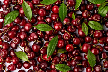 background made of sweet cherry fruits isolated on white background
