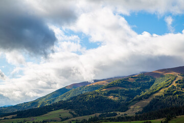 morning in the mountains. Sunrise over the mountain range sky in the clouds. Beautiful landscape.
