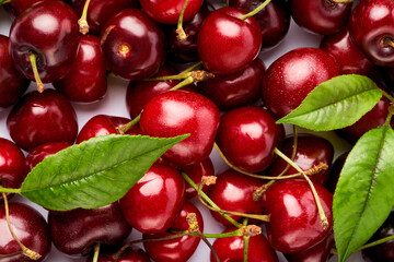 background made of sweet cherry fruits isolated on white background