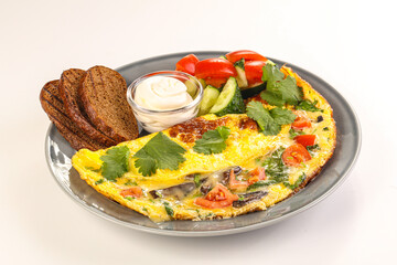 Fried egg with vegetables and bread