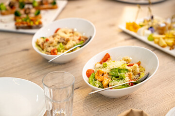 Catering. serving the table with appetizers and salads for the holiday. ordering ready meals and serving banquets. .