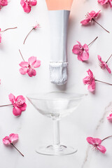 Rose light  champagne  summer-spring background with beautiful soft flowers. Summer drink for party, wine shop or wine tasting concept, flat lay