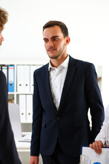 Group of people sit in office deliberate on problem