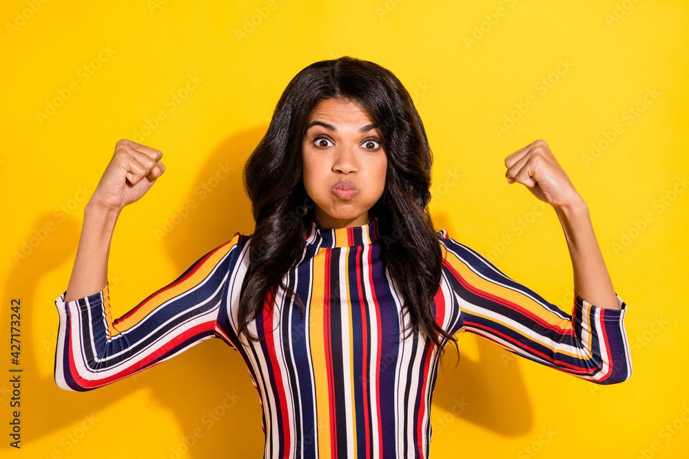 Poster photo portrait of funky woman showing strong biceps feminist keeping ait in cheeks isolated on vibra