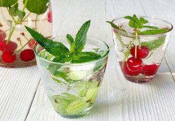 Fresh cool drink of ripe juicy cherry and gooseberry berries