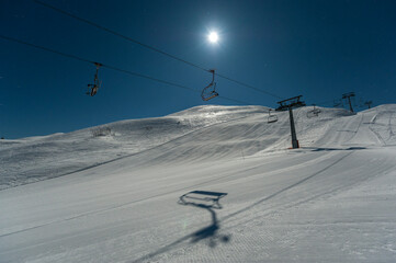 Fototapeta na wymiar Ski lift in the moonlight, Vogel, Slovenia