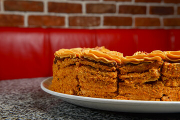 Chocolate honey cake, selective focus. Delicious sweet cake for tea or coffee time.