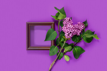 Valentine's Day card with bouquet of lilacs on paper background. Symbolic heart.