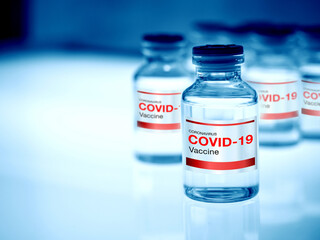 Covid-19 Coronavirus vaccine bottle with label.