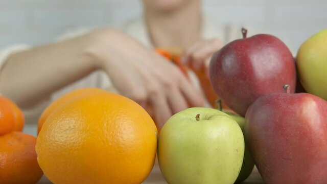 Eco life with bags. Woman puts fruits in reusable bags.