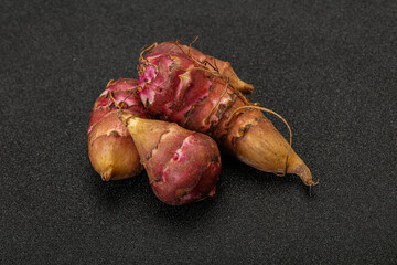 Raw topinambur root or Jerusalem artichoke