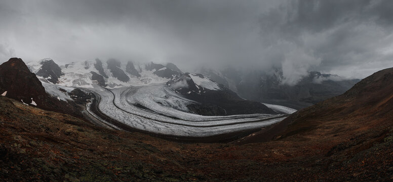 Panorama view onto Diavolezza glacier with Piz Pal&uuml; from summit of Diavolezza station in St. Moritz during a foggy summer day (St. Moritz, Switzerland, Europe)