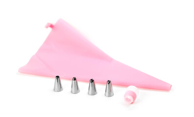 Pink cooking bag with various metal attachments. Close up. On a white background