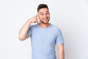 Fototapeta premium Russian handsome man over isolated background making phone gesture. Call me back sign