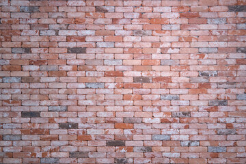 Vintage red brick wall, background. Retro wall of light and dark bricks, copy space for text