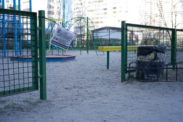 Outdoor playground for children. Fenced territory, coronavirus pandemic. High quality photo