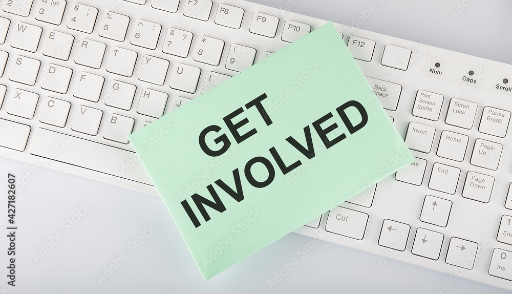 Aufkleber text get involved on envelope on keyboard on the white background