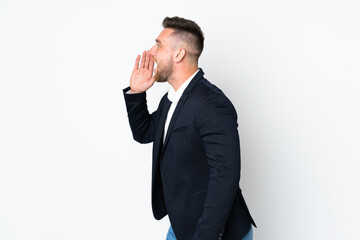 Young Russian business man isolated on white background shouting with mouth wide open