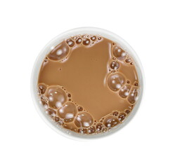 Chocolate milk puddle in glass isolated on white background, top view