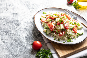 Traditional oriental salad Tabouleh. Tabule cous cous salad with vegetables. Tabbouleh with bulgur