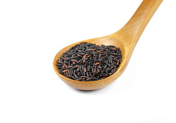 Pile of Brown Rice in a wooden spoon isolated. Organic black rice isolated on white background.