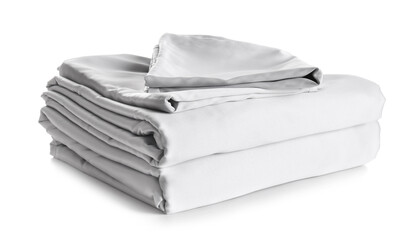 Stack of clean silky bed linen isolated on white