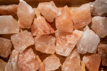 Close up of crystals of pink himaayan solt. Natural background of stones
