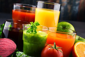 Glasses with fresh organic vegetable and fruit juices