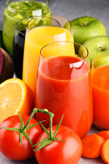 Glasses with fresh organic vegetable and fruit juices