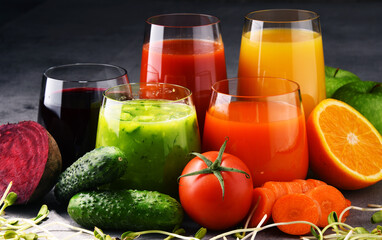 Glasses with fresh organic vegetable and fruit juices
