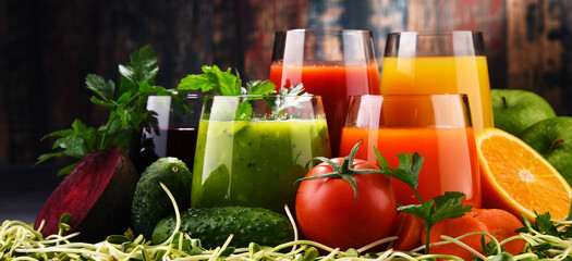 Glasses with fresh organic vegetable and fruit juices
