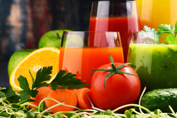 Glasses with fresh organic vegetable and fruit juices