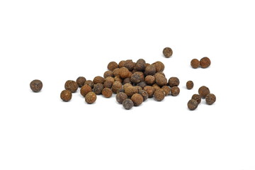 Allspice, pimento spice, Jamaican pepper pile isolated on white background