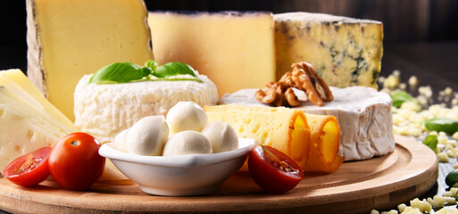 Different sorts of cheese on kitchen table