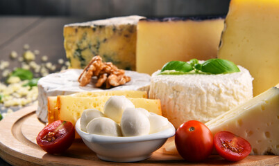 Different sorts of cheese on kitchen table