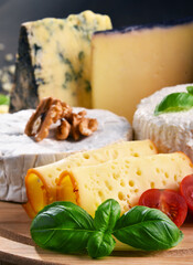 Different sorts of cheese on kitchen table