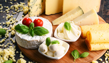 Different sorts of cheese on kitchen table