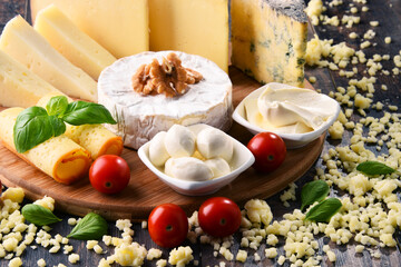 Different sorts of cheese on kitchen table