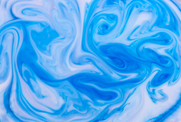 Obraz premium Abstract background of swirling blue waves of ink