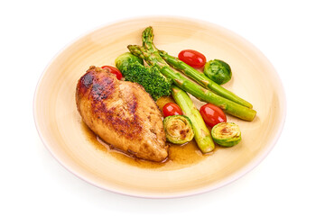 Grilled chicken breast with vegetables. Healthy food, isolated on white background. High resolution image