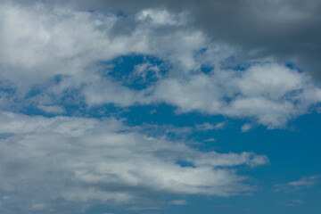 Naklejka na ściany i meble Clouds on a spring Sunday in the Mediterranean