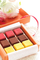 Multiple color and favor chocolate in gift box for holiday image