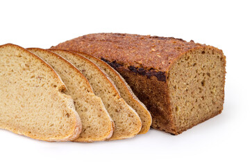 Sliced gray bread and partly cut grain bread close-up