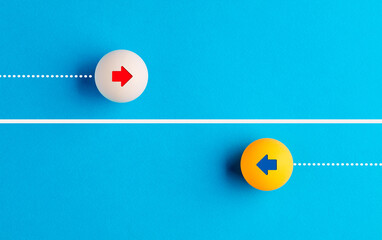 Arrow icons in contrast on table tennis balls moving towards opposite directions. - obrazy, fototapety, plakaty