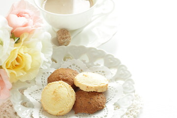 Homemade coffee and vanilla cookie with flower