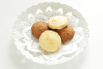Homemade coffee and vanilla cookie with flower